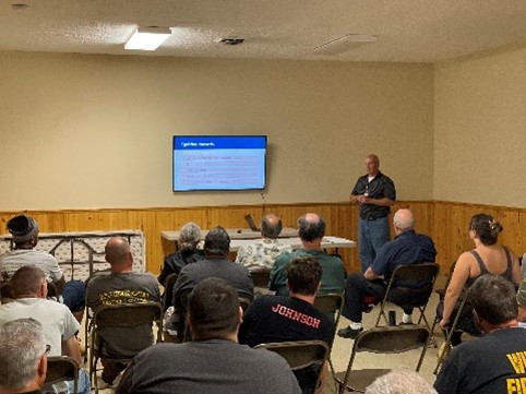 A person giving a presentation to an audience